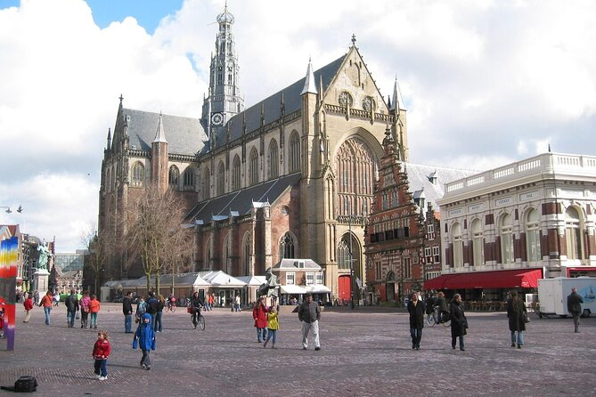 90 minutes Self-Guided Walking tour with puzzles in Haarlem - Stop 1 to Stop 2: from station views to Molen De Adriaan at dusk