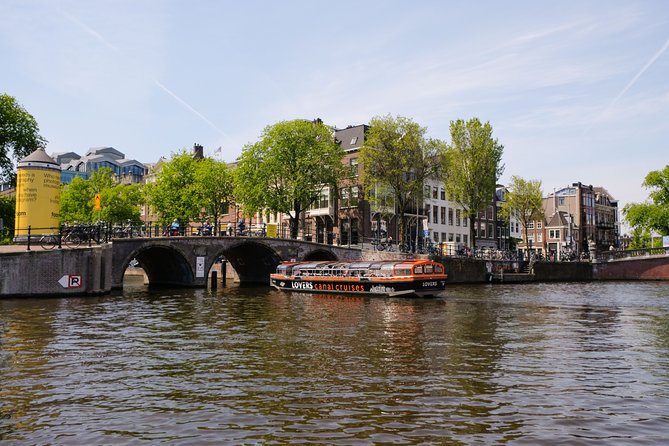 Amsterdam 1h Canal Cruise by Semi-Open Boat with Audio Guide - Singel Canal + Museum Exteriors: A Clean Slice of City Life