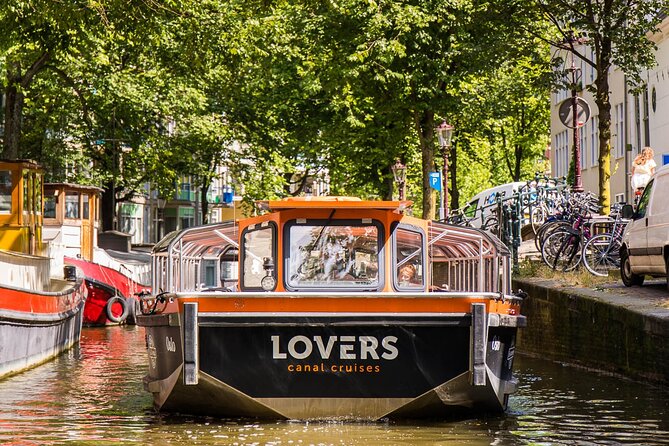 Amsterdam 1h Canal Cruise by Semi-Open Boat with Audio Guide - Heineken’s Oldest Brewery Area: A Fun Endcap to the City Tour