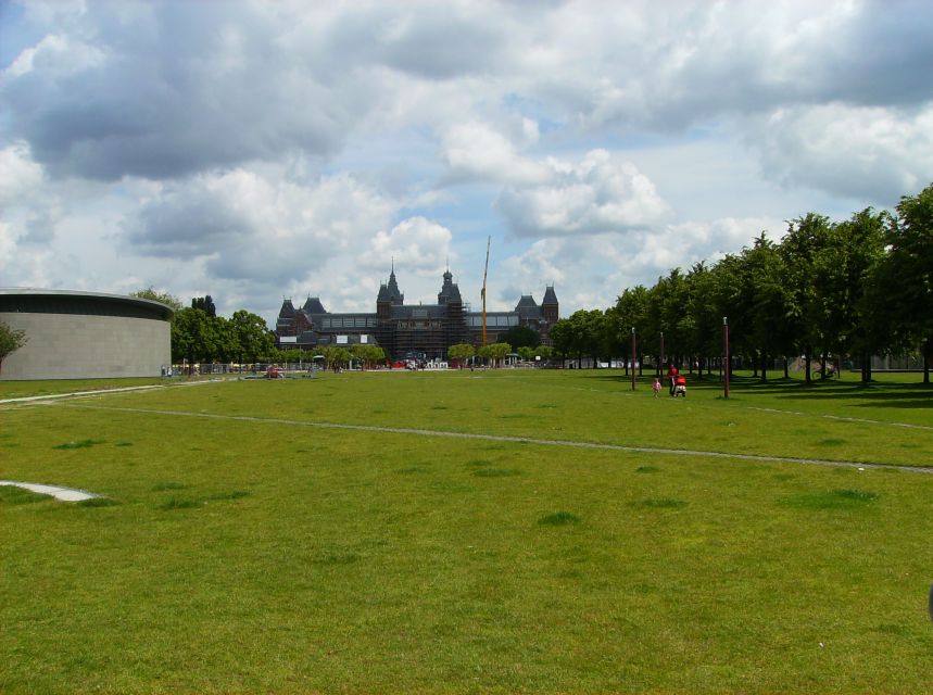 Amsterdam: 2-Hour Sightseeing Tour by Rickshaw - Comfort and practicalities: rain cover, sound, and body needs