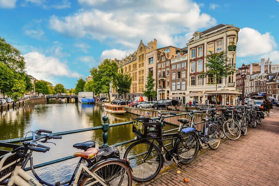 Amsterdam: 3-Hour Private Bike Tour of the City Center - Heineken Brewery: an easy photo stop in an industrial-canal setting