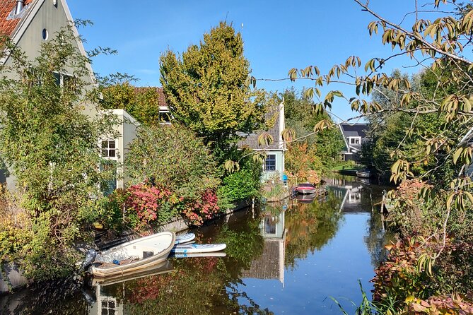 Amsterdam and Countryside Private Full-Day Tour by luxury car - Canal Belt to old town: how the guide turns streets into meaning