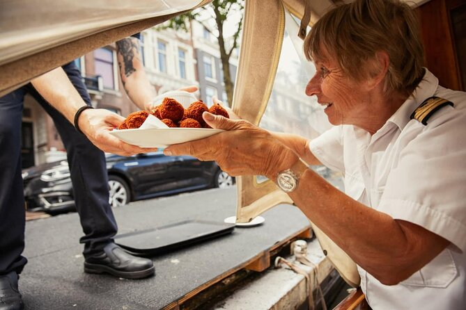 Amsterdam Canal Cruise and local Food Tour - One Hour on a Restored Wooden Saloon Boat