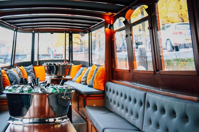 Amsterdam Canal Cruise in Classic Salon Boat With Drinks and Cheese - Stop 1 in plain terms: Amsterdam from the water for about one hour