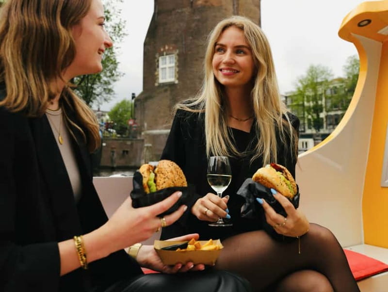 Amsterdam canal cruise with culinary burger or cheese & wine - On the water: how the host, skipper, and audio guide work together
