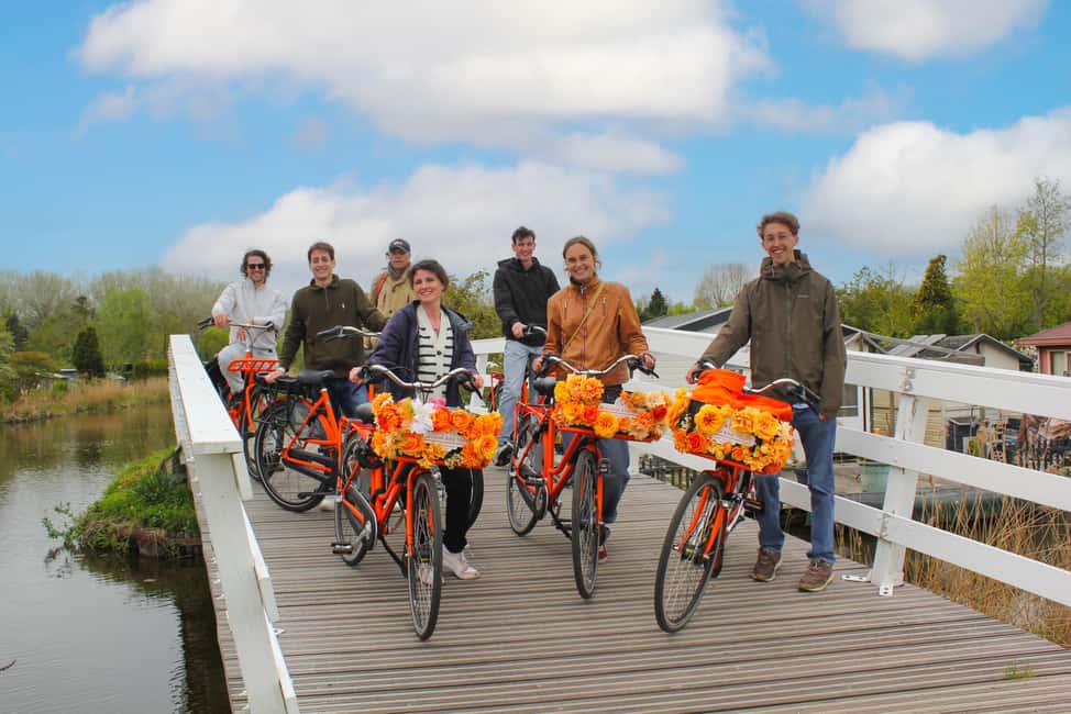 Amsterdam: Cheese, Windmill & Countryside Bike Tour - Nieuwendammerdijk dike biking and the Ransdorp church tower stop