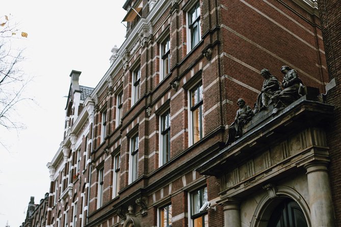 Amsterdam City Center Guided Walking Tour Semi-Private 12ppl Max - Trippenhuis and the narrow-house lesson: how land taxes shaped the skyline