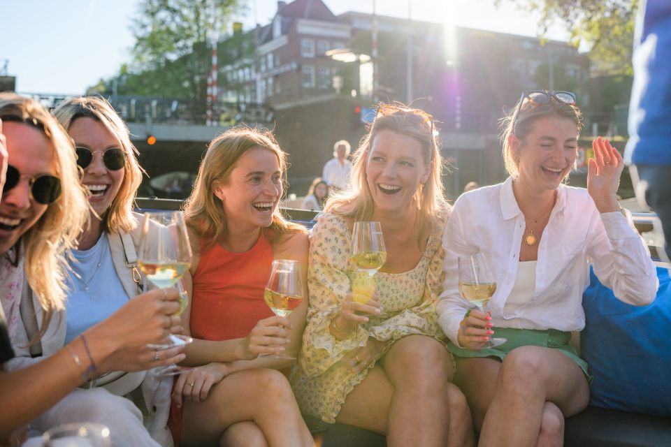 Amsterdam: Covered Canal Booze Cruise with Unlimited Drinks - Boat comfort and weather reality: rain or shine, with help