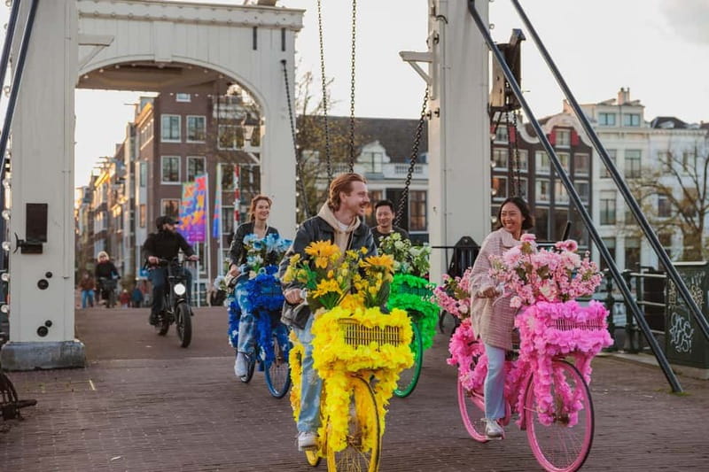 Amsterdam: Explore Canals, Guided Tour on Flower Bikes - Where You Start Near Central Station, and How the Ride Gets Going