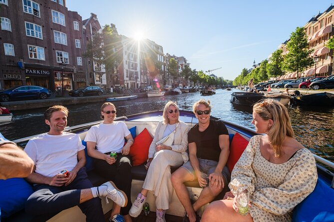 Amsterdam: German-speaking boat trip with bar on board - Magere Brug (the Skinny Bridge): drawbridge legend and best night photos