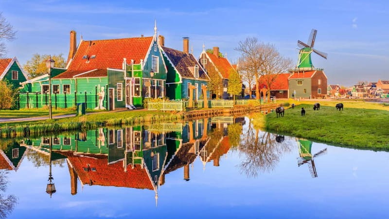 Amsterdam: Giethoorn & Zaanse Schans Small Group Day Trip - Meeting in Amsterdam: Oosterdokskade and the Albert Heijn landmark