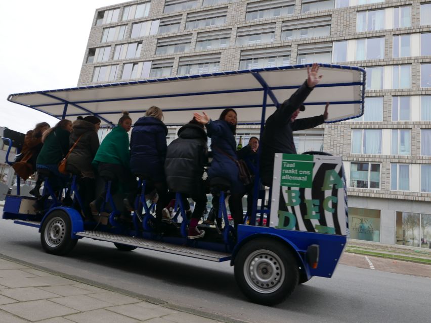 Amsterdam: Guided Beer or Prosecco Bike Tour - Your party bike setup: seats, guide + driver, and the group feel