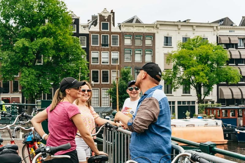 Amsterdam: Guided Bike Tour City Centre in EN/DE/FR/ES - Western Islands: drawbridges, warehouses, and artist-studio vibes