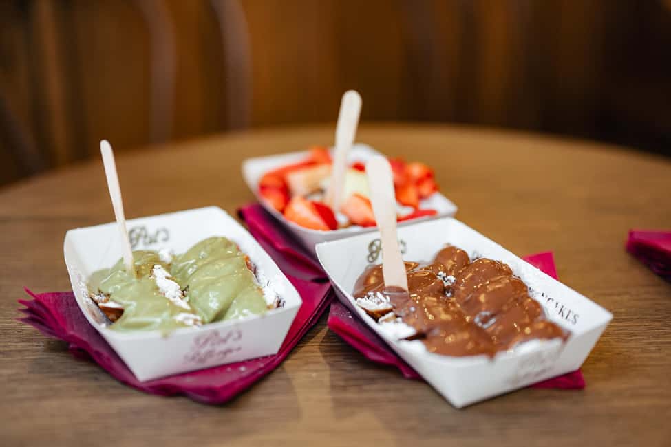 Amsterdam: Guided Cultural Food Tour in German or English - Beurs van Berlage and Magna Plaza: when architecture meets everyday Amsterdam