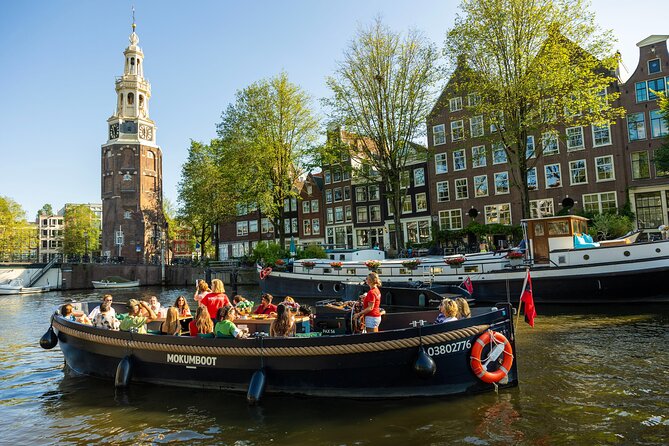 Amsterdam: Guided Open Boat Canal Cruise Unlimited Drinks Option - An Open-Boat Hour Through Amsterdam’s Canal Belt