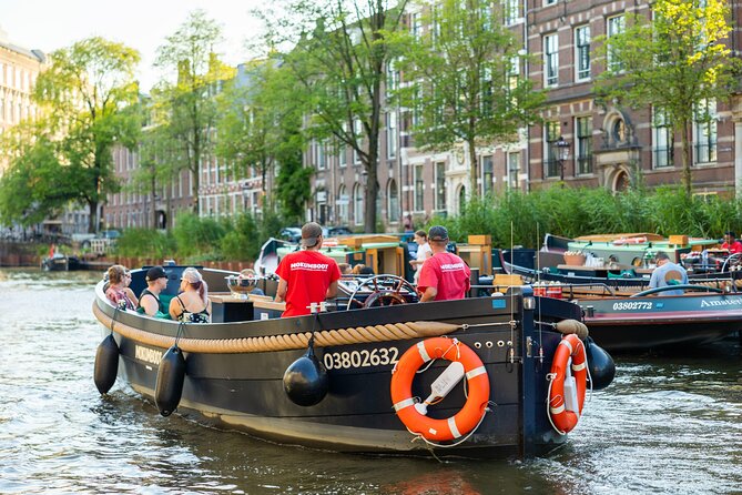 Amsterdam: Guided Open Boat Canal Cruise Unlimited Drinks Option - Should You Book This Mokumboot Canal Cruise?