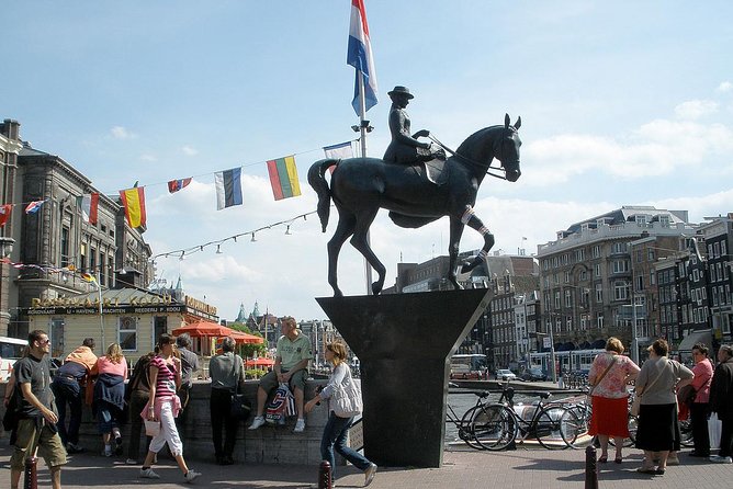 Amsterdam: History, Culture & Highlights tour - What to expect on the ground: walking pace, timing, and meeting point
