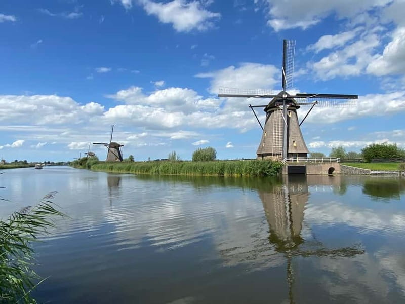 Amsterdam: Kinderdijk, Euromast, Delft and Den Haag Day Tour - From Amsterdam pickup to a full Holland loop in 8.5 hours