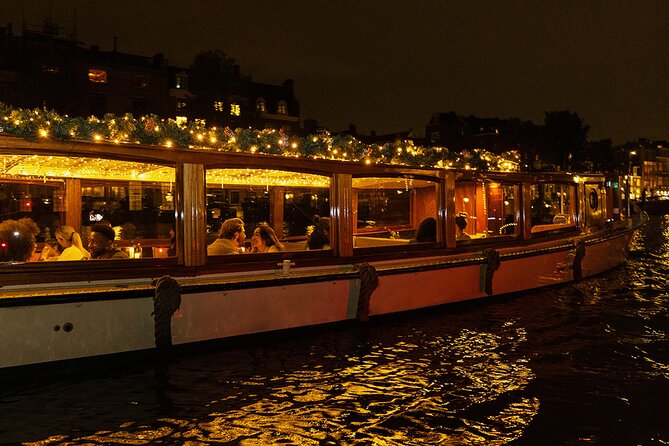 Amsterdam Light Festival: Heated Cruise with Hot Drinks & Bite - Heated saloon boat, real lights on the canals