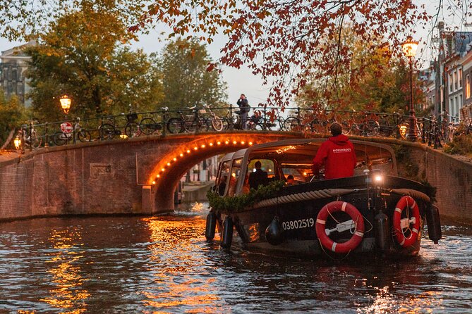 Amsterdam: Light Festival Open Boat - Unl. Drinks Option - A stage for ballet and opera, then a true-or-false drawbridge legend