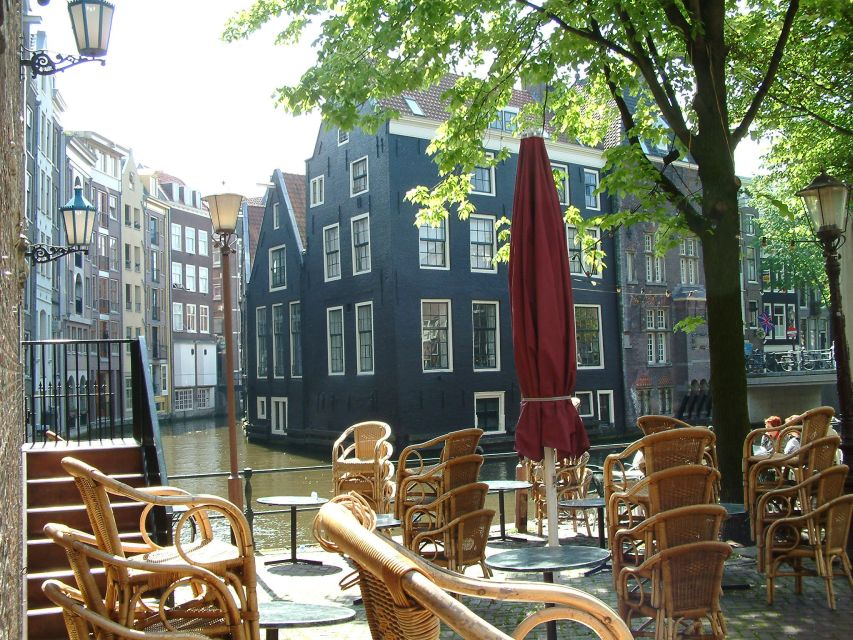 Amsterdam Old City Private Walking Tour - Jordaan merchant houses, old pawn shops, and canal glamour