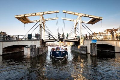 Amsterdam Open Boat Cruise in Old City Center with Live Guide - Meeting at Amstel 51F: your starting point near the Hermitage Museum