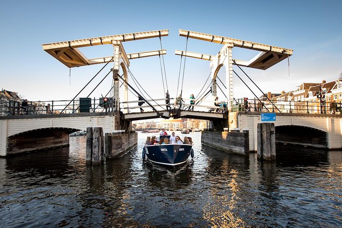 Amsterdam Open Boat Cruise in Old City Center with Live Guide - Meeting at Amstel 51F: your starting point near the Hermitage Museum