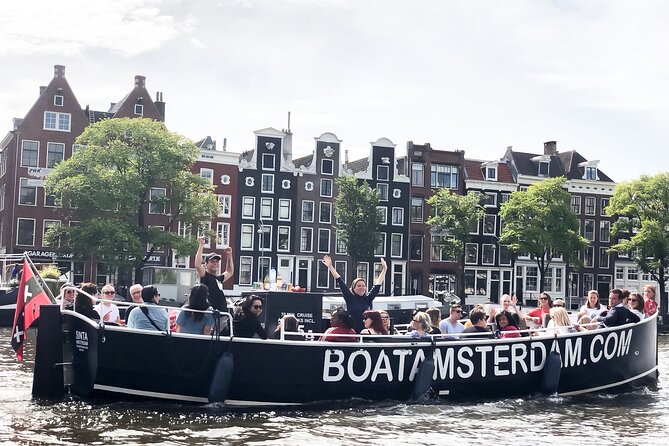 Amsterdam Open Boat Cruise in Old City Centre with Drinks Options - What you see in 1 hour: Amstel, UNESCO canals, and bridge after bridge