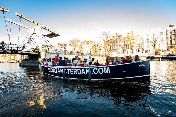 Amsterdam Open Boat Cruise with Live Guide and Two Drinks - Jordaan and the well-known red-light area passing-by