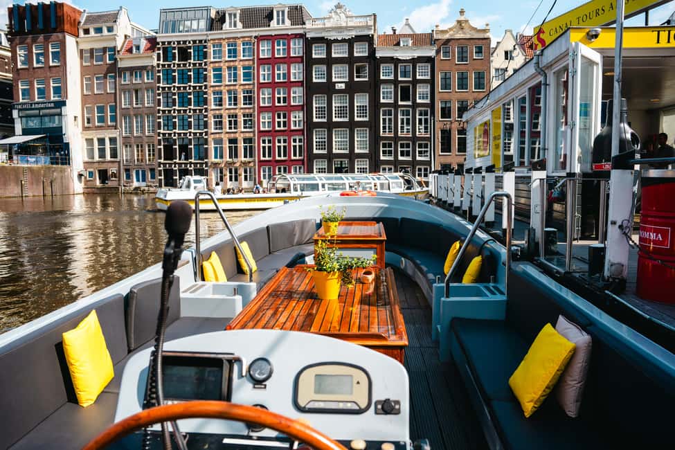 Amsterdam: Open Boat Tour of Canals with Expert Local Guide - Logistics That Matter: Finding the Boat and Timing