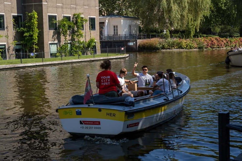 Amsterdam: Open Boat Tour of Canals with Expert Local Guide - Stop-by-Stop: What You’ll See and How to Watch