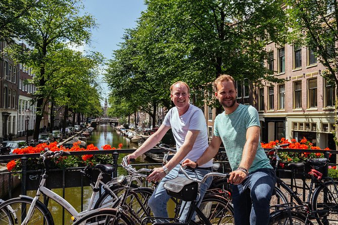 Amsterdam PRIVATE Bike Tour With Locals: Bike & Local Snack Included - Homomonument: respectful pause with local storytelling