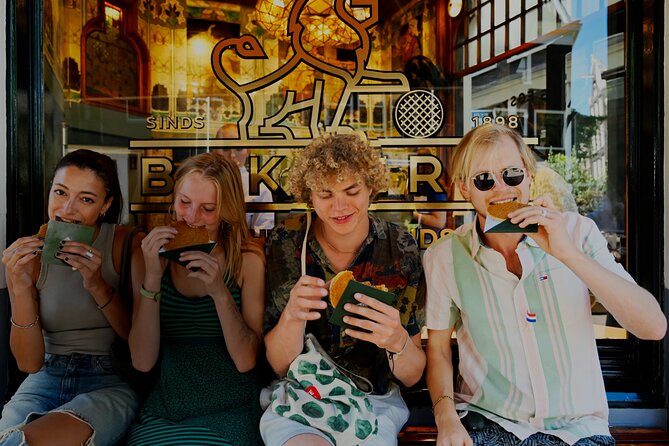 Amsterdam Private Food & Drinks Tour by UNESCO Canals & Jordaan - Flower Market, Spui University, and a 15th-Century Secret Garden