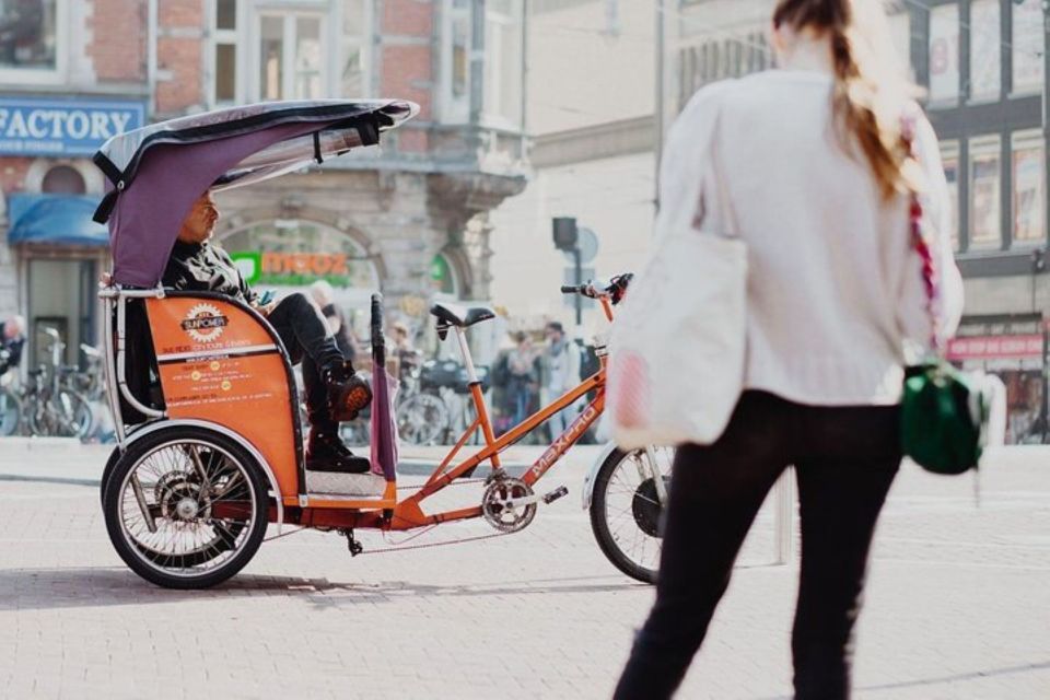 Amsterdam: Private Guided City Tour by Pedicab - Your Route: Damrak, Canals, Flower Market, and the Jordaan Loop