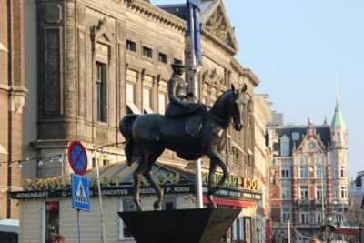 Amsterdam: Private Hidden Gems Discovery Tour - From Dam Square to the palace that began as city hall