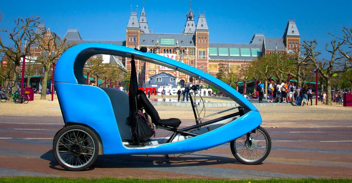 Amsterdam: Private Pedicab Historical Sightseeing Tour - Montelbaanstoren and the Oude Waal: defenses, lookout points, and houseboats