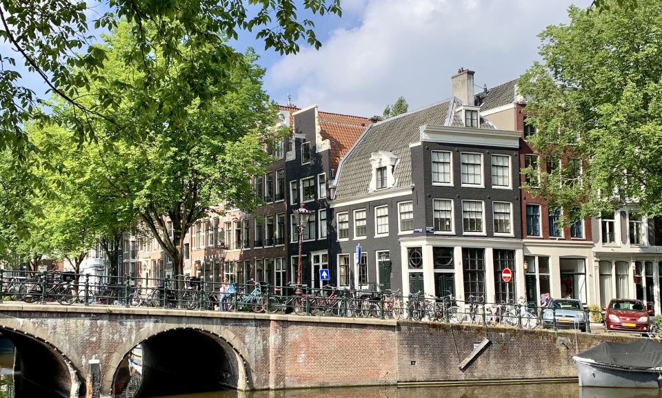 Amsterdam: Red Light District & City Tour German or English - The Red Light District segment: what’s explained and why it matters