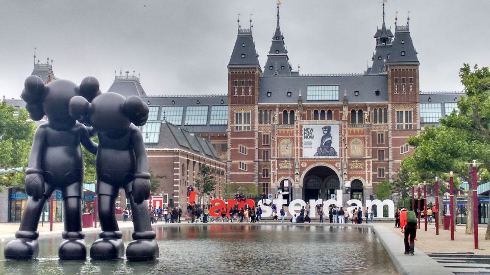 Amsterdam: Sex, Drugs, and Freedom Walking Tour - The Walk Starts in the Center: Royal Palace, Dam Square, and Quick Orientation