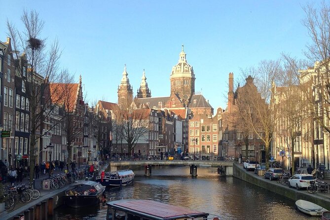Amsterdam Sightseeing Tour + Hidden Gems + Tastings + PDF guide - Bloemenmarkt and Munttoren: The Floating Market and the Money Angle