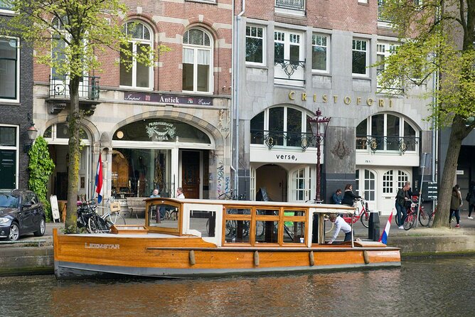 Amsterdam small-group canal cruise in 1920s saloon boat - A 1928 fully electric saloon boat is the real star
