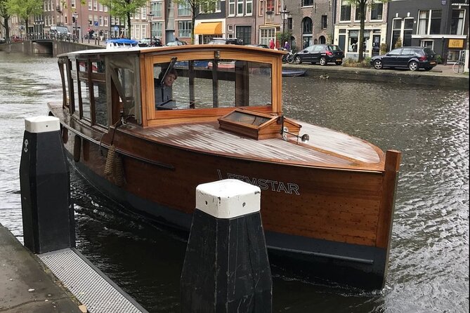 Amsterdam small-group canal cruise in 1920s saloon boat - Prinsengracht, Herengracht, Keizersgracht, Reguliersgracht: the canal belt in motion