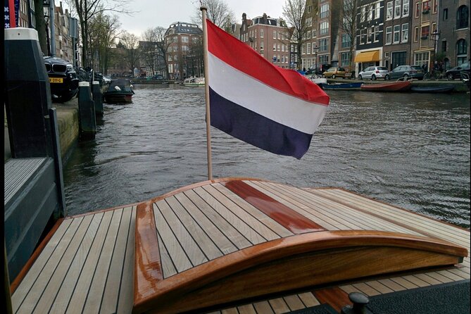 Amsterdam small-group canal cruise in 1920s saloon boat - Comfort on board: heater, blankets, and covered seating