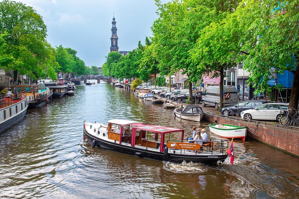 Amsterdam: Small-Group Canal Cruise incl. Drinks and Snacks - Getting on the Giuliana: what makes it feel different from big boats