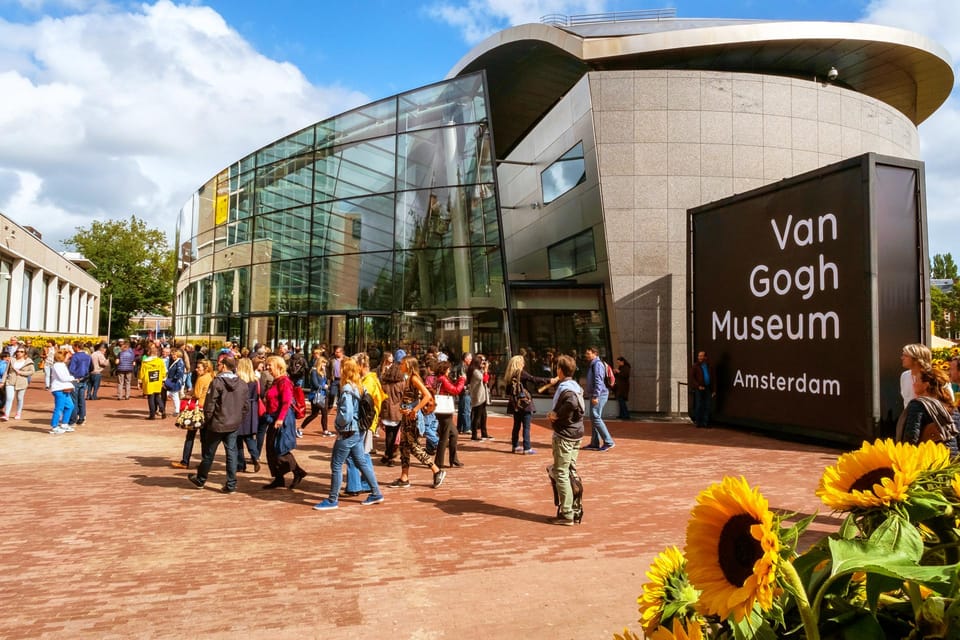 Amsterdam Van Gogh Museum Guided Tour with Tickets Included - Meeting the guide at the Museumshop entrance (white umbrella tip)