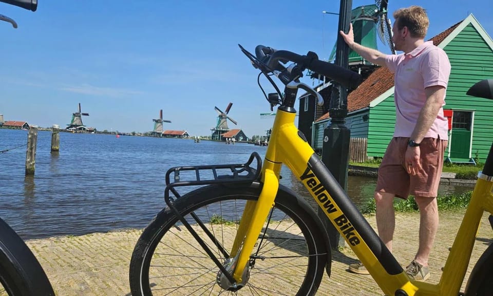 Amsterdam: Zaanse Schans E-Bike Tour with Windmills & Cheese - Yellow Bike meeting point and how the ride fits real people