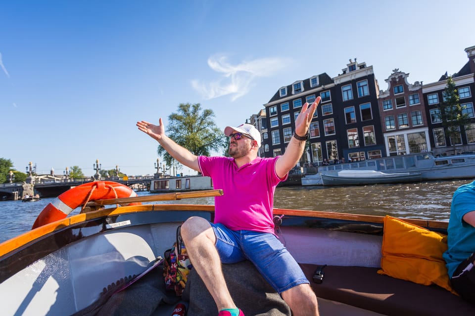 Amsterdam:1.5-Hour Canal Cruise local Guide, Drinks & Snacks - Timing Tips for an Open-Air Amsterdam Canal Ride