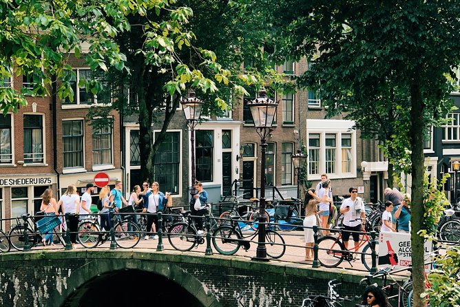 Amsterdam's Unexpected Treasures Private Walking Tour - Canals and St. Nicholas Basilica: old waterfront vibes and a drink-story twist