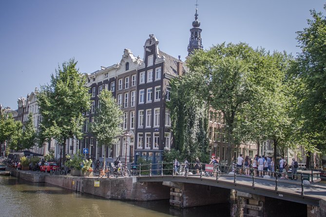 Anne Frank Private Bike Tour in Amsterdam - Passing the Dutch National Opera & Ballet and the Skinny Bridge
