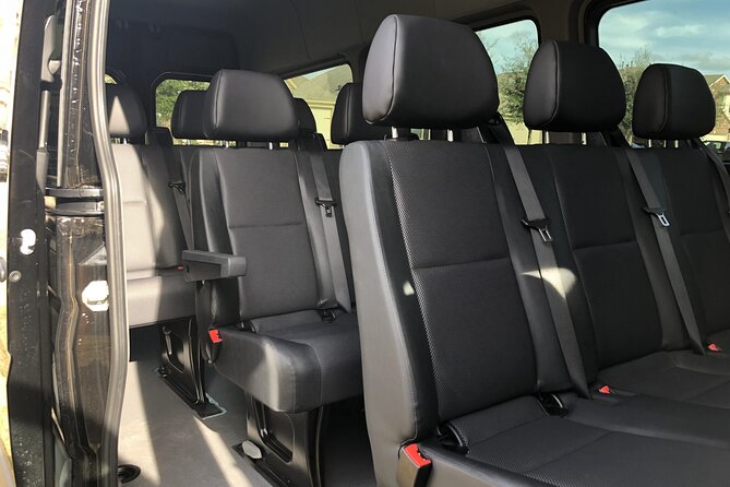 Arrival Private Transfer Amsterdam Airport to Amsterdam City Center by Minibus - Meeting at Schiphol: Sign, Arrival Hall, and Easy Communication