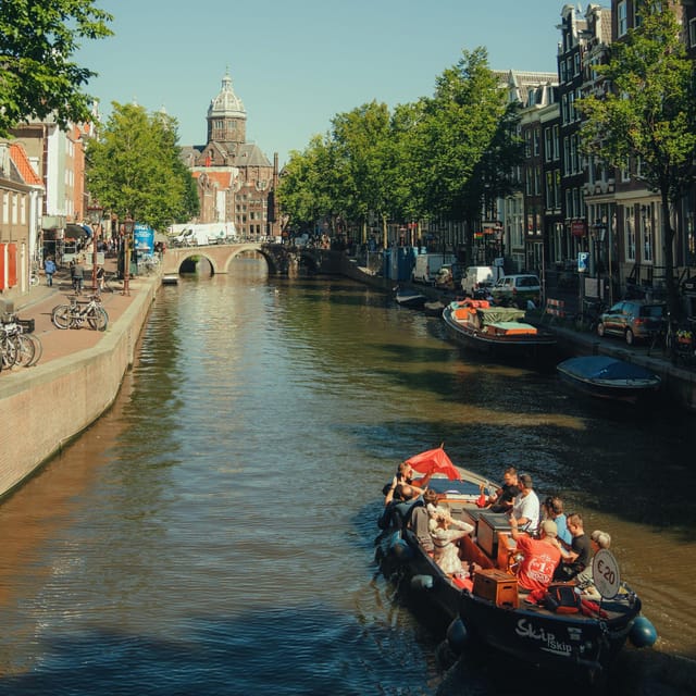 COZY AND FUN CANAL TOUR: A UNIQUE JOURNEY THROUGH AMSTERDAM - Stopera and Herengracht: architecture and a smoother sense of flow